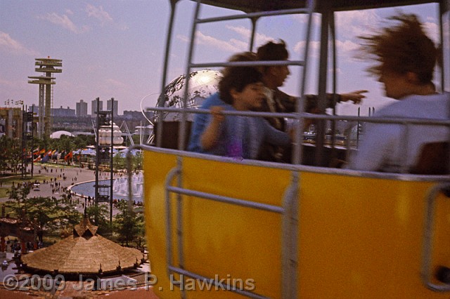 slides/04 - WF65_05.jpg  Passing Cable car with New York  State Pavilion in Background on left